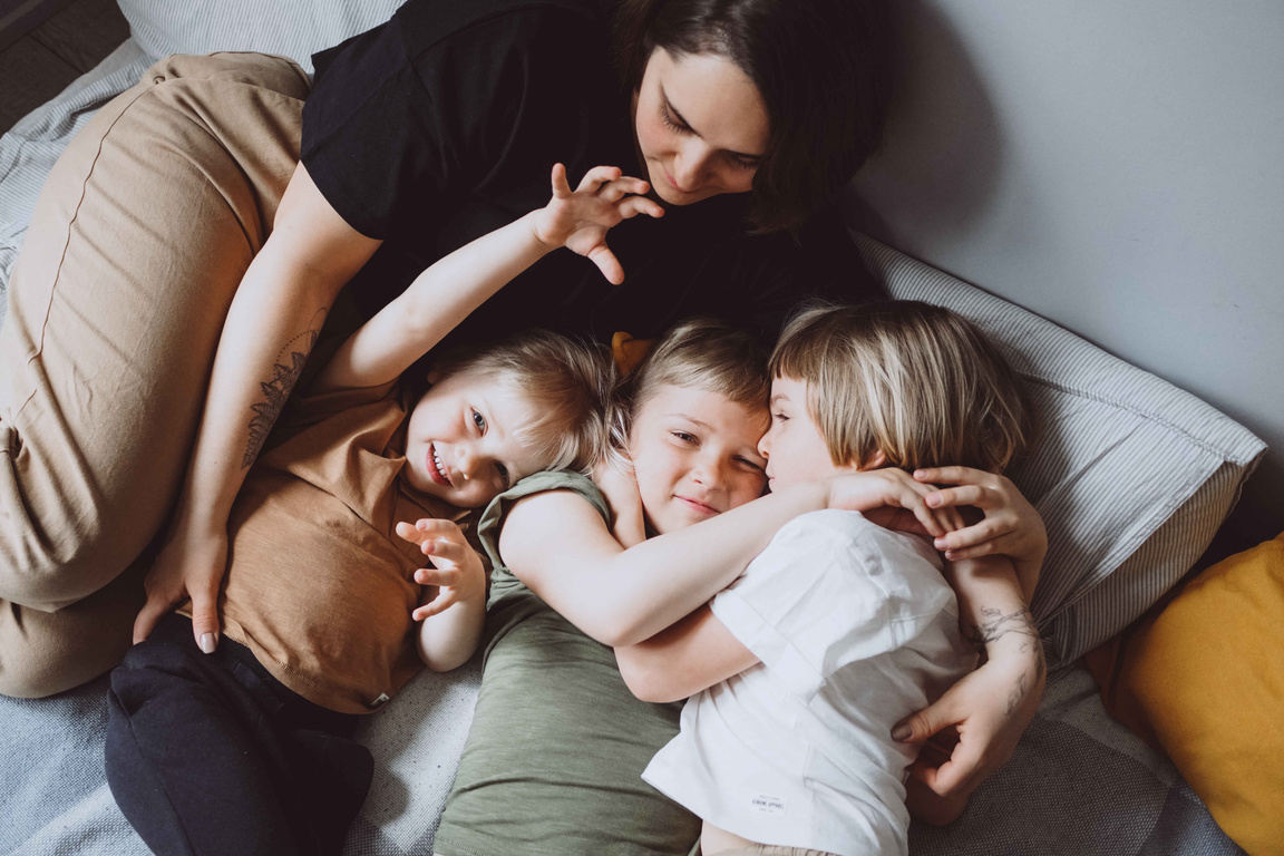 Family Playing in Bed